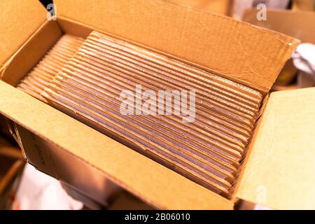 A pack of cardboard boxes under warm light Stock Photo