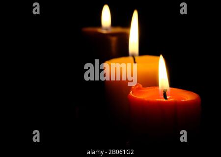 close up of burning candle at night  Stock Photo
