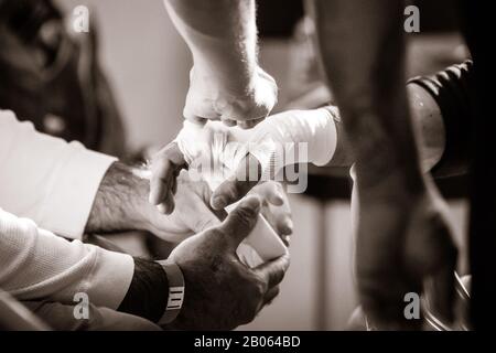 Team Wrapping Hand in MMA Fight Stock Photo