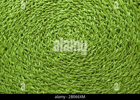 Beautiful pattern and texture of vibrant green colored woven sedge place mat Stock Photo