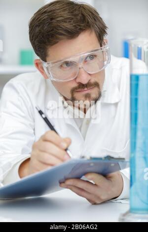 taking notes in the lab Stock Photo