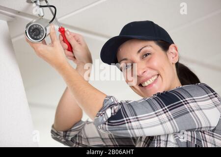 client getting securty camera installed Stock Photo