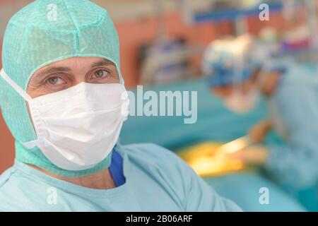 portrait of a surgeon in front of the operation room Stock Photo