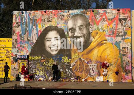 General overall view of Kobe Bryant memorial mural at Sparadise La Brea at 1251 St. La Brea Ave., Sunday, Feb 16, 2020, in Los Angeles. The mural, created street artist Thierry Guetta aka Mr. Brainwash, showcases Bryant and his daughter Gigi Bryant (Gianna Bryant), with the former basketball player wearing a Lakers sweatshirt against a colorful background and newspaper images of Bryant during his NBA years, on the front. There is another image of Bryant in his purple Lakers uniform with a quote of his written next to him on the side of the building. This mural also pays tribute to the other se