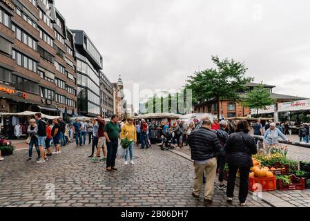 Hamburg, Germany - August 4, 2019: The Hamburg Fish Market by the Elbe on sunday. People at the fresh produce market. Stock Photo