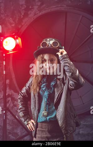 Beautiful steampunk teen girl  over vintage background , model in the style of a steampunk in a beautiful creative studio. Fashion, style Stock Photo