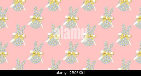 Easter background horizontal banner. Seamless pattern. Easter bunny rabbit on a pink background. Design for textile, fabric and wrapping paper. Stock Photo