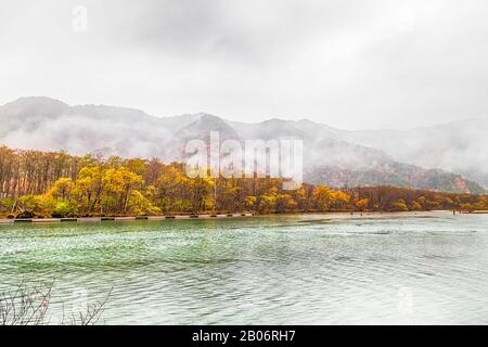 Kamikochi National Park in the Northern Japan Alps of Nagano Prefecture, Japan. Beautiful mountain in autumn leaf with river. Stock Photo