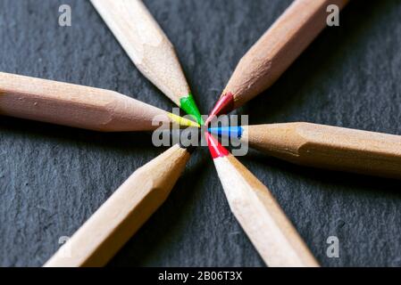 Close-up of colored pens on a dark background Stock Photo