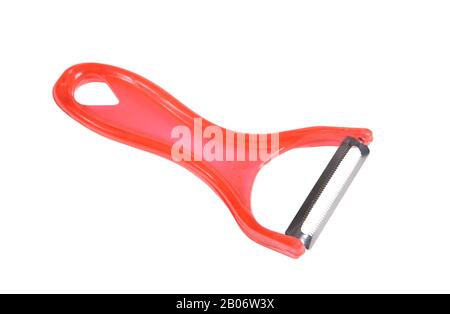 Red plastic peeler for vegetables and fruits isolated on white background Stock Photo