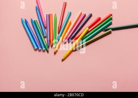 Assortment of colorful felt tip pens on pastel pink background Stock Photo