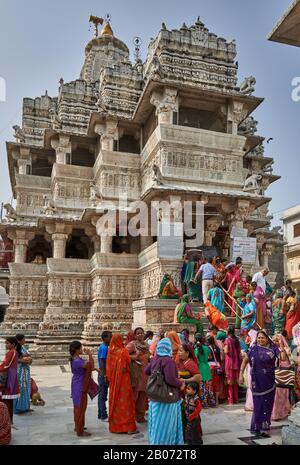 indian women with colorful clothes during ceremony inside Jagdish Temple, Udaipur, Rajasthan, India Stock Photo