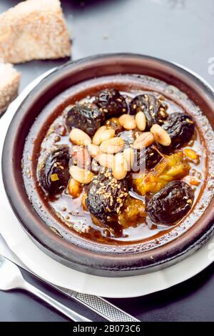Chicken tajine with plums and almonds, sesame seeds Stock Photo