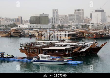 Doha / Qatar – February 18, 2020: Traditional dhows moored up by Doha corniche Stock Photo