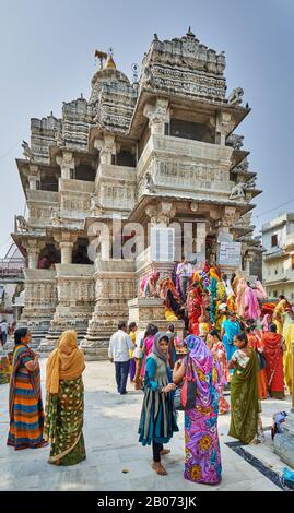 indian women with colorful clothes during ceremony inside Jagdish Temple, Udaipur, Rajasthan, India Stock Photo