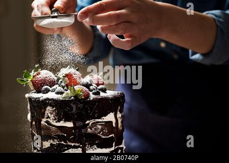 Chef is making chocolate cake Stock Photo