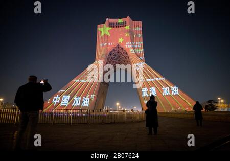 (200219) -- TEHRAN, Feb. 19, 2020 (Xinhua) -- The Azadi Tower is illuminated in Tehran, Iran, on Feb. 18, 2020, to show support to the epidemic-hit city of Wuhan in central China. The Azadi Tower, a landmark monument in the Iranian capital of Tehran, was lit up here on Tuesday night, as part of a ceremony showing support for China in the face of the novel coronavirus outbreak. (Photo by Ahmad Halabisaz/Xinhua) Stock Photo