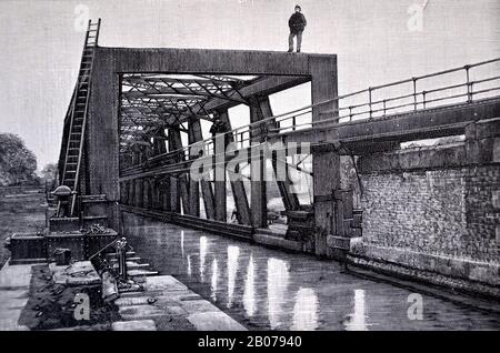 Archival black and white photograph of the Barton Swing Aqueduct, a moveable navigable aqueduct in Barton upon Irwell, Greater Manchester, England, United Kingdom, carrying the old Bridgewater Canal across the Manchester Ship Canal : from the book: 'A Survey of the History, Commerce and Manufactures of Lancashire' by Reuben Spencer, published 1897. Stock Photo