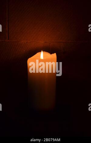 Flickering Candle in Church - Filey - North Yorkshire - UK Stock Photo