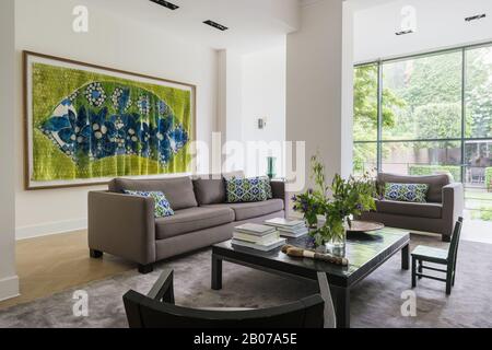 Modern living room with green and blue painting Stock Photo