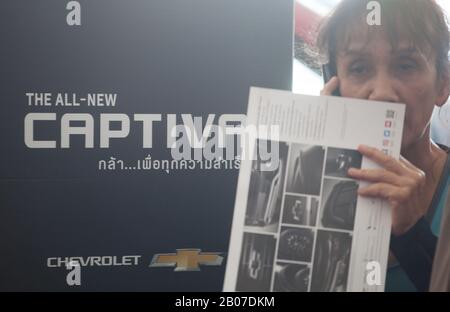 January 1, 2000, Bangkok, Thailand: A woman holds a brochure at the showroom..General Motors Company Limited and Chevrolet Sales announces the end of sales 2020 and offers reduced prices by 30-50% for Chevrolet vehicles in Thailand. (Credit Image: © Adisorn Chabsungnoen/SOPA Images via ZUMA Wire) Stock Photo