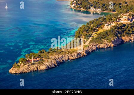 lighthouse in Bay of Pollensa on the peninsula Les Pedreres, Faro de Punta de la Avanzada, 09.01.2020, aerial view, Spain, Balearic Islands, Majorca, Port De Pollenca Stock Photo