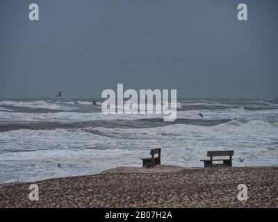 Henne beach in Jutland with benches on a stormy day, Denmark Stock Photo