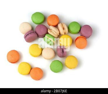 round baked multi-colored almond flour cakes macarons, dessert  isolated on a white background, top view Stock Photo