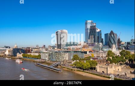 Aerial cityscape of the Thames river on a sunny day with the City Financial district skyscrapers and Tower of London. Stock Photo