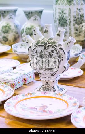 Delft, Netherlands - April 8, 2016: Pottery workpieces with hand painting of Delftware in pottery factory, Royal Delft Stock Photo