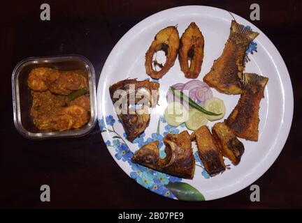 Bengali food Fish Fry with Prawn Malai Curry also known as Chingri Malai Curry in Bengali. An authentic traditional Bengali cuisine Stock Photo