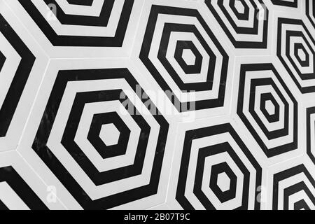 Modern hexagonal wall tiling background, abstract geometric black and white pattern Stock Photo