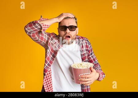 Experiencer Young guy in 3d glasses watching cinema Stock Photo