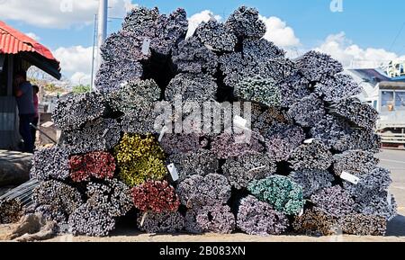 Close-up of piles of steel bars, marked on its end with different colors for easier identification, seen in the port area in Iloilo City, Philippines Stock Photo