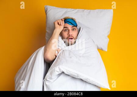 Funny guy woke up on yellow background Stock Photo