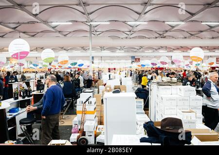 Strasbourg, France - Feb 16, 2020: Wide angle view over hundreds of people and exhibitors at Vignerons independant English: Independent winemakers of France wine fair for private and horeca customers Stock Photo