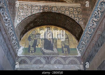 Turkey. Istanbul. Hagia Sofia. Byzatine mosaic. Virgin Mary with Jesus, emperors Constantine and Justinian. Tympanum. 994. Stock Photo