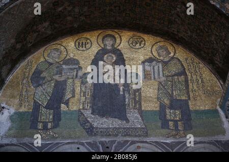 Turkey. Istanbul. Hagia Sofia. Byzatine mosaic. Virgin Mary with Jesus, emperors Constantine and Justinian. Tympanum. 994. Stock Photo