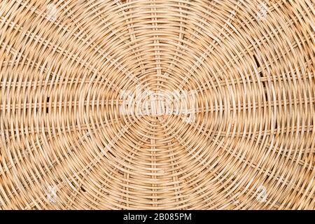 Rattan. Woven Mat made of cane or straw-yellow. Dry cane texture. Light yellow. Stock Photo