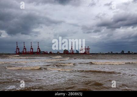 Looking across the River Mersey on a stormy day towards Liverpool 2 docks from New Brighton Wallasey UK Stock Photo
