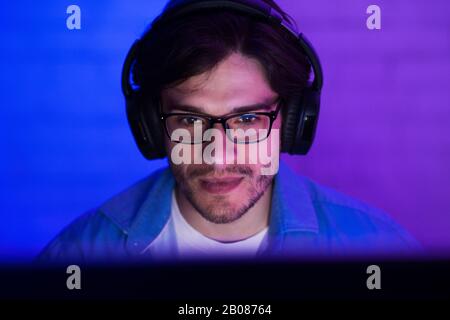 Guy At Desktop PC Playing Computer Game Indoor At Night Stock Photo
