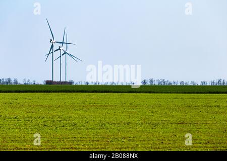 Eco wind turbine supplying clean power. Wrestling for a clean environment Stock Photo