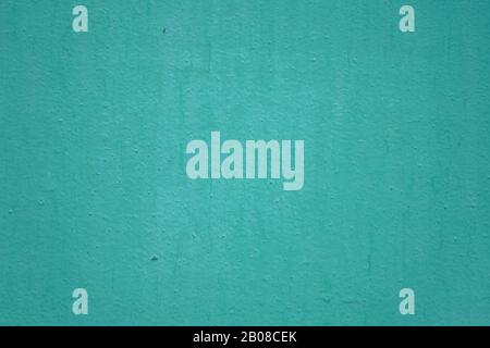 The wall is painted with green oil paint. Green wall texture for background and design Stock Photo
