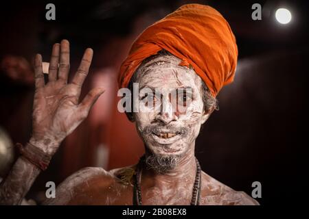 A Hindu holy man, or Naga sadhu, pose for photos after  applies ashes on his body at the premises of the Pashupatinath Temple ahead of the Shivaratri festival in Kathmandu, Nepal February 19, 2020. (Photo by Prabin Ranabhat/Pacific Press) Stock Photo