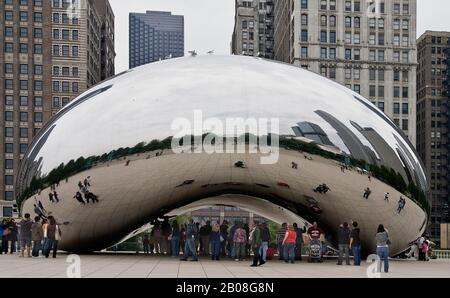 Cloud Gate  or The Bean sculpture by Indian born British artist Sir Anish Kapoor situated Millenium Park in the loop district of Chicago. . Stock Photo