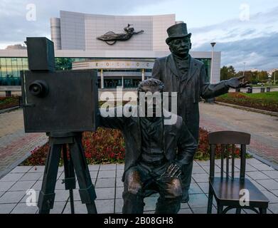 Bronze sculputre of Lumiere brothers with old fashioned camera, Kosmos concert hall, Yekaterinburg, Siberia, Russia Stock Photo