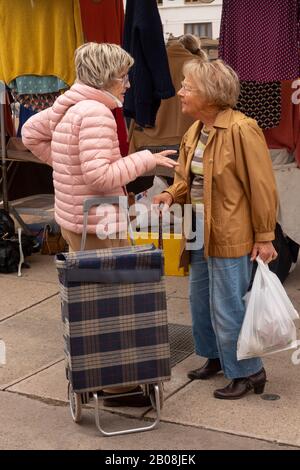 senior women talking on street in Paris France Stock Photo