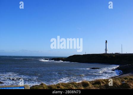 Aberdeen Coastline at Nigg Bay, Lighthouse in Distance, Aberdeen Feb 2020 Stock Photo