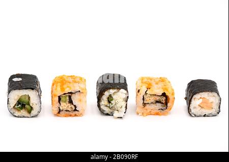 Close Up Of Various Types Of Japanese Fresh Prepared Sushi on white isolated background . Stock Photo