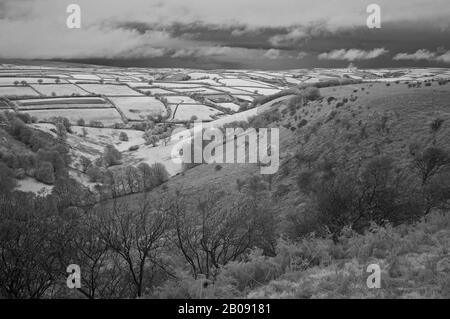 Infrared picture of the view from the top of the Winsford Hill looking down across The Punchbowl, in the Exmoor National Park, Somerset, England, UK Stock Photo